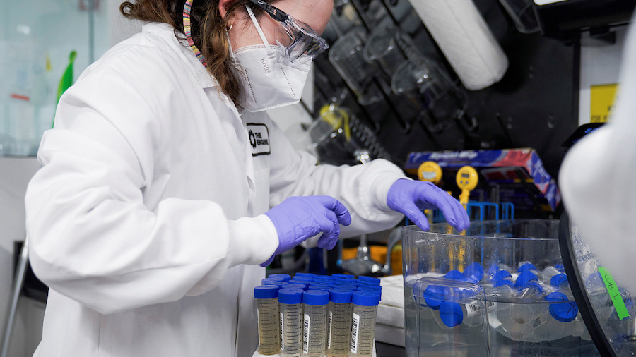 A lab technician tests wastewater samples from around the United States in Cambridge, Massachusetts...
