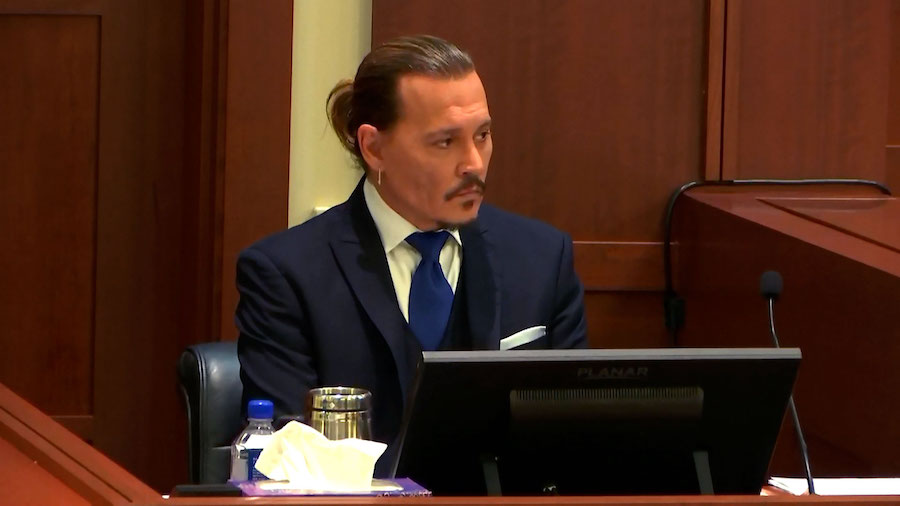 FILE: Actor Johnny Depp has resumed testifying in his defamation trial against and Amber Heard in a...