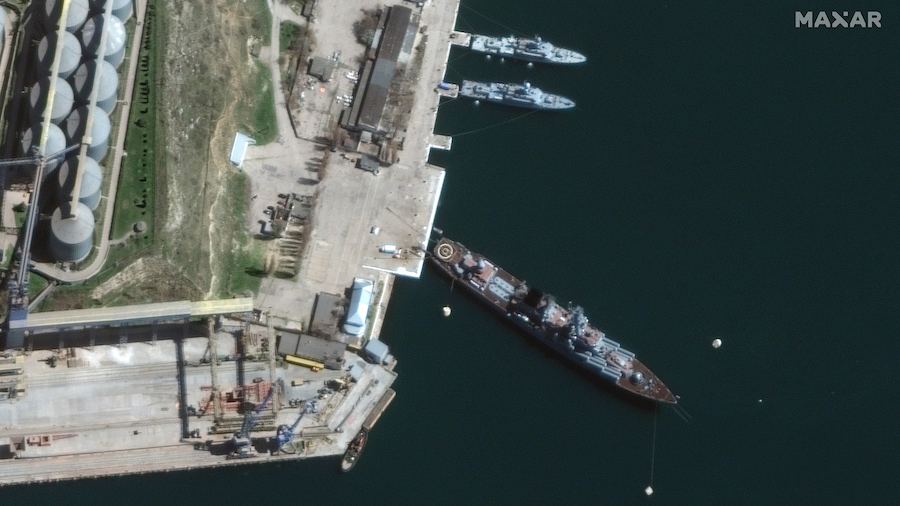The Russian Navy cruiser Moskva, bottom, is seen in port in Sevastopol, Crimea, on April 7. (Satell...