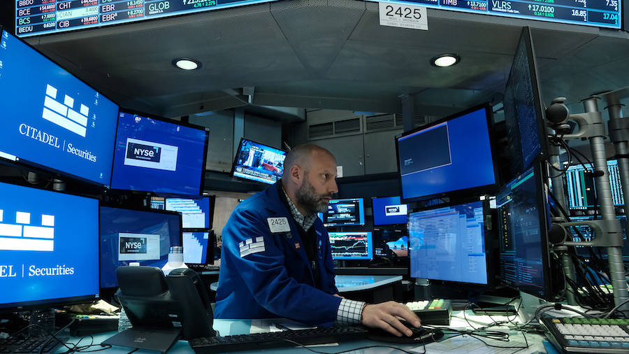 Traders work on the floor of the New York Stock Exchange (NYSE) on April 28, 2022 in New York City....