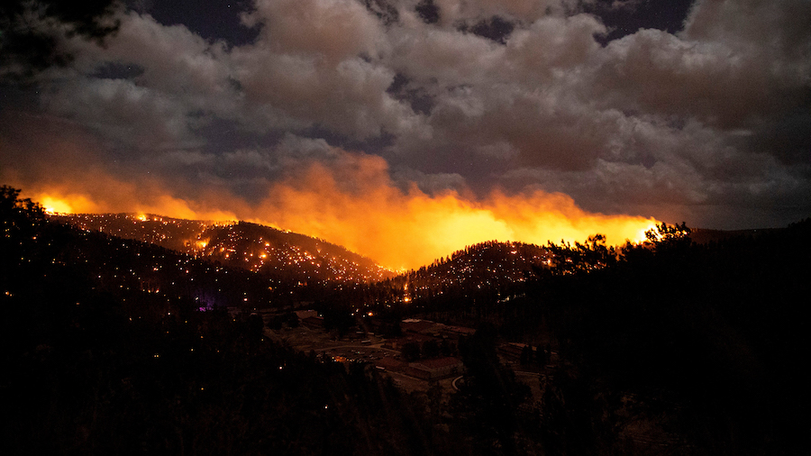 The McBride Fire burns Tuesday in the heart of the village of Ruidoso, New Mexico. (Ivan Pierre Agu...