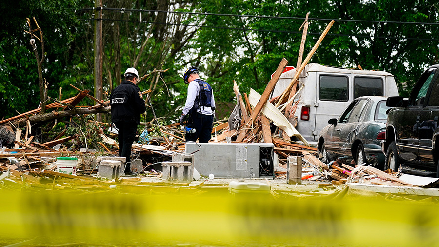 Investigators work the scene of a deadly explosion in a residential neighborhood in Pottstown, Pa.,...
