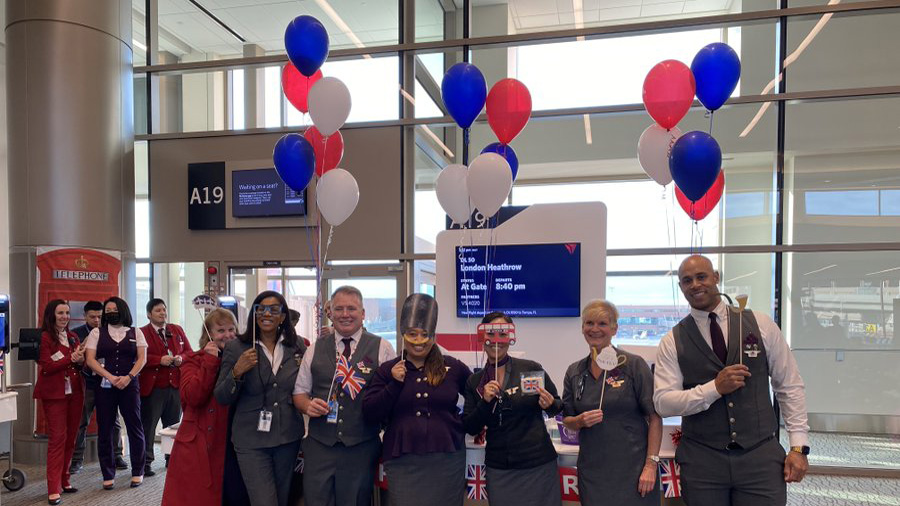Delta airlines employees celebrate the airline's decision to resume flights to London. (Salt Lake C...