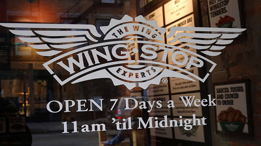 CHICAGO, ILLINOIS - MAY 06: The Wingstop logo is seen on the front door of one of the company's res...