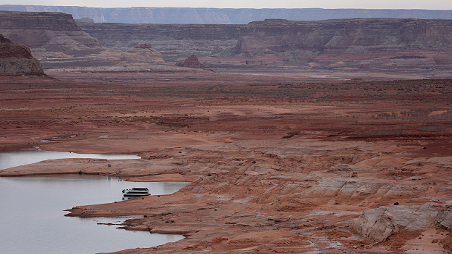 PAGE, ARIZONA - MARCH 28: A houseboat sits anchored on the banks of Lake Powell on March 28, 2022 i...