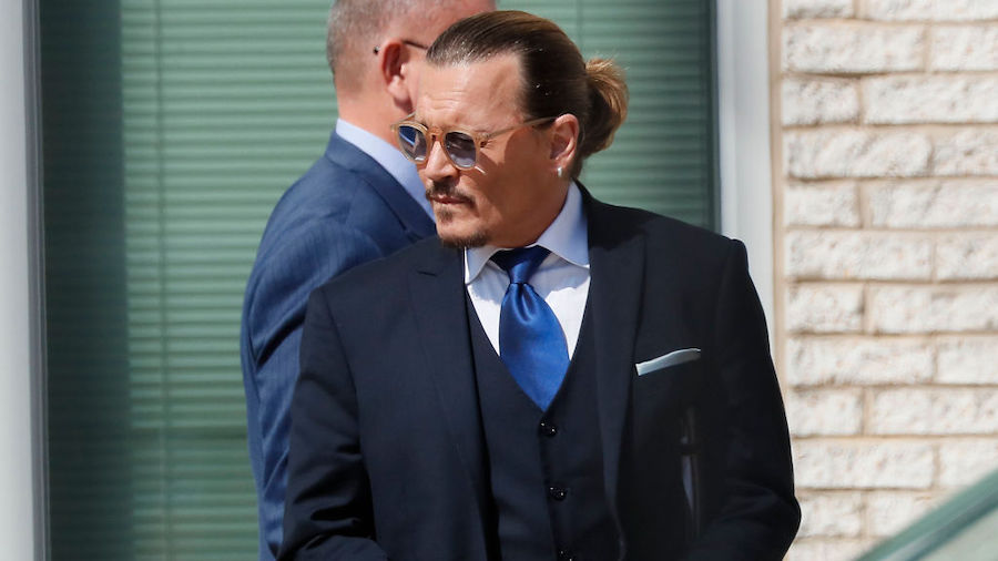 Johnny Depp steps outside court during his civil trial at Fairfax County Circuit Court on April 25,...