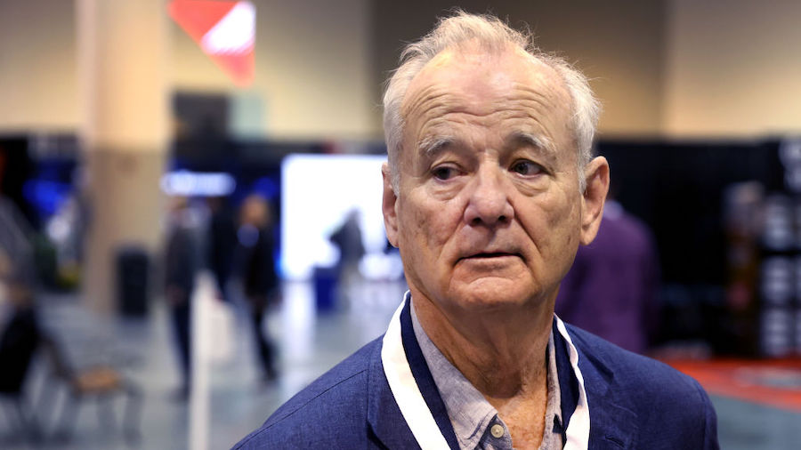 Actor and comedian Bill Murray walks through the convention floor at the Berkshire Hathaway annual ...