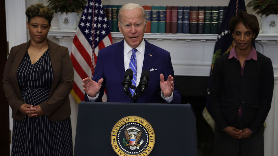 President Joe Biden speaks as Director of the Office of Management and Budget Shalanda Young (L) an...