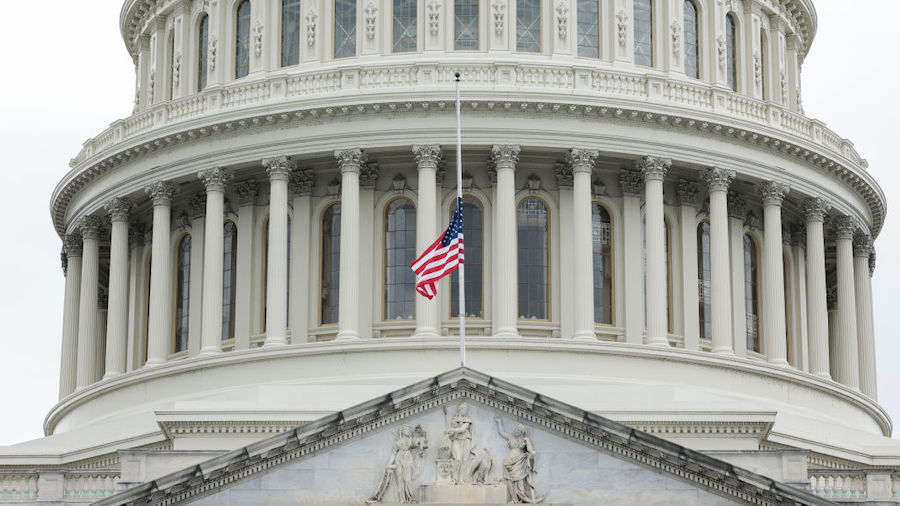 The U.S. flag flies at half staff over the U.S. Capitol Building in Washington, DC on May 12, 2022 ...