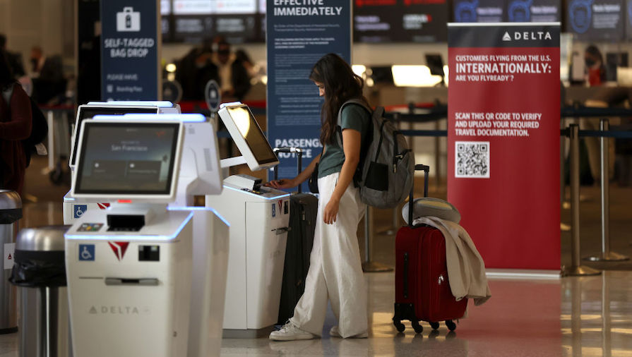 A Delta Air Lines customer checks in for a flight at San Francisco International Airport on May 12,...