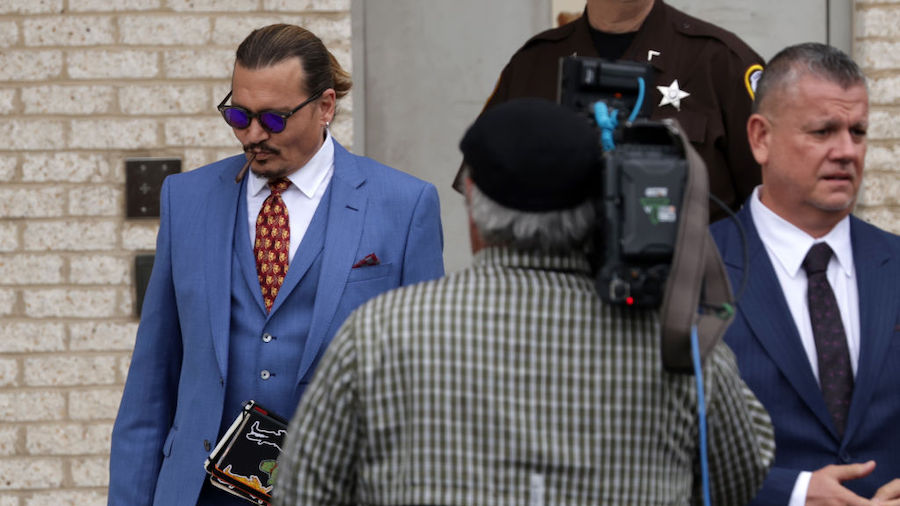 Actor Johnny Depp leaves the Fairfax County Courthouse during his defamation case brought against e...