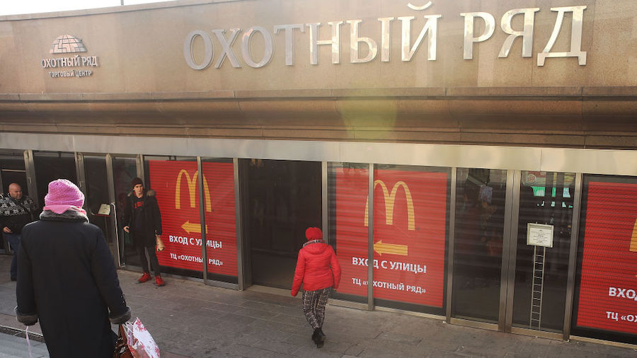 FILE: Russians walk into a McDonald's restaurant in Moscow on March 7, 2017 in Moscow, Russia. (Pho...