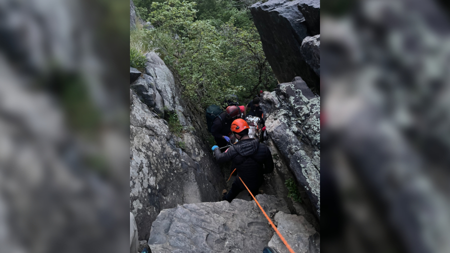 Rescue crews getting the fallen climber out of the rocks. (Credit: Salt Lake County Sheriff's Searc...