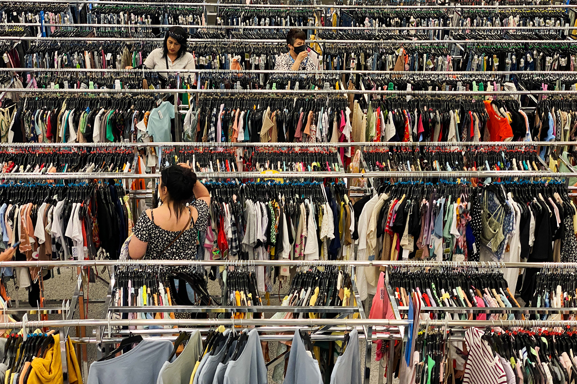 Customers browse racks of clothing as they shop inside a discount department retail store in Las Ve...