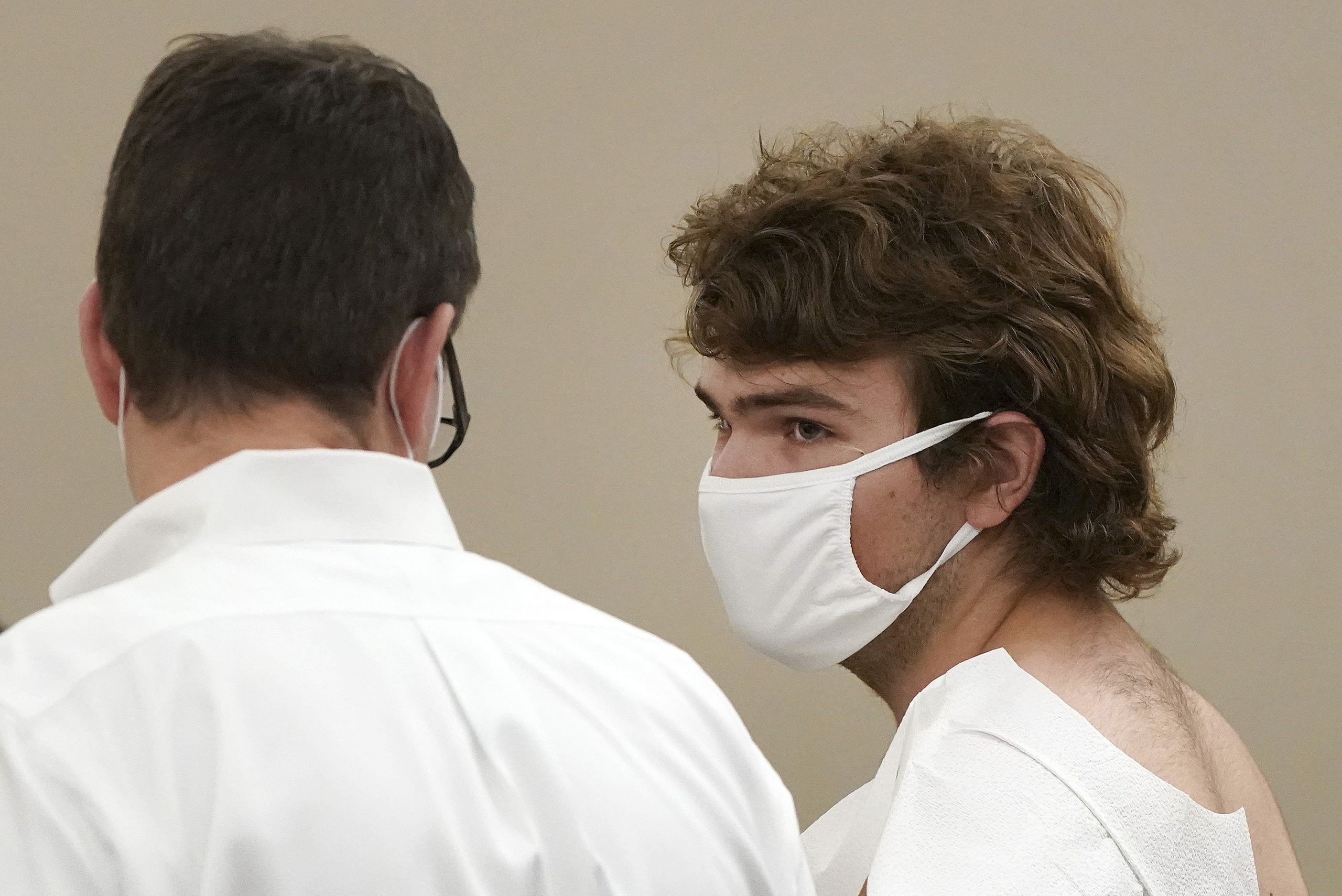 Payton Gendron talks with his attorney during his arraignment in Buffalo City Court, Saturday, May ...