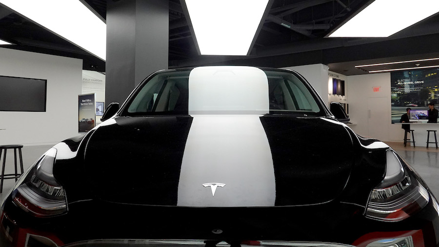 Tesla pictured here, on October 21, 2021 in Miami, Florida recalled 129,960 vehicles this month to ...