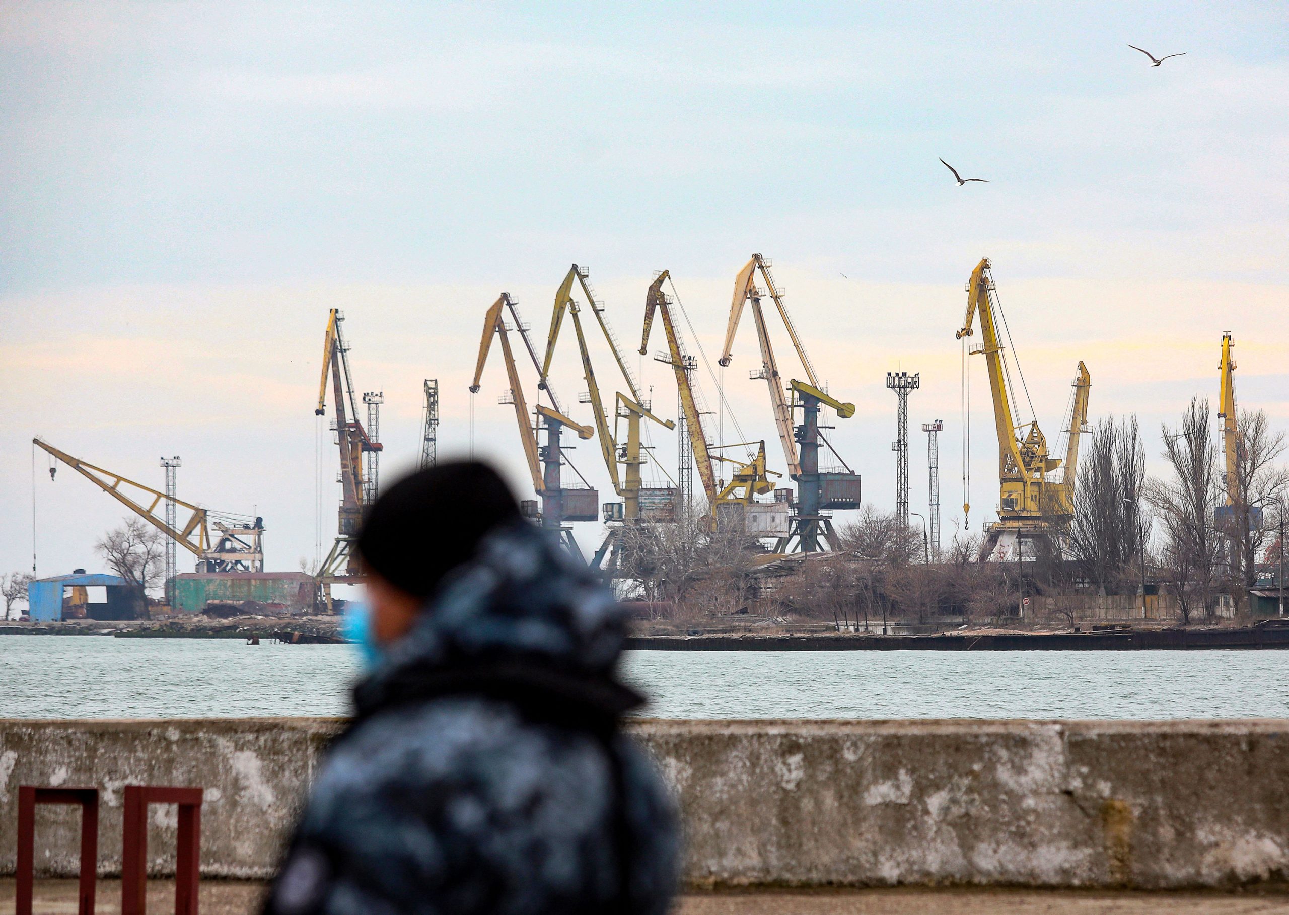 A serviceman walks in the border base in front of Ukraine's Black Sea port of Mariupol on February ...