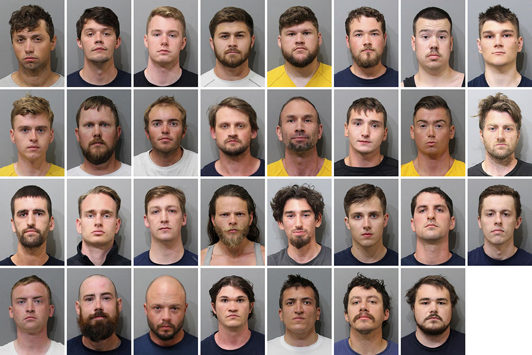 These booking images provided by the Kootenai County Sheriff’s Office show the 31 members of the ...