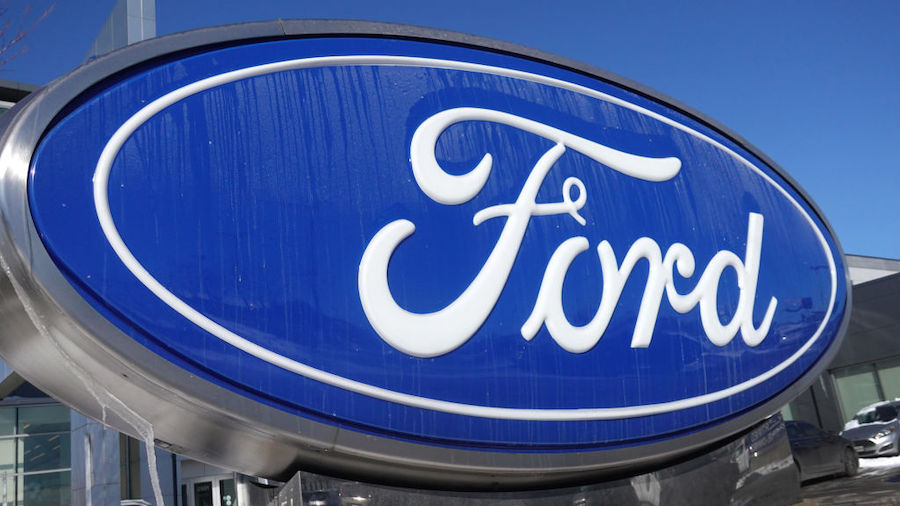 A Ford sign sits outside of a dealership on January 25, 2022 in Chicago, Illinois. Ford Motor Co. a...