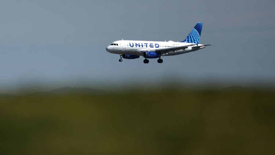 A United Airlines plane lands at San Francisco International Airport on March 07, 2022 in San Franc...