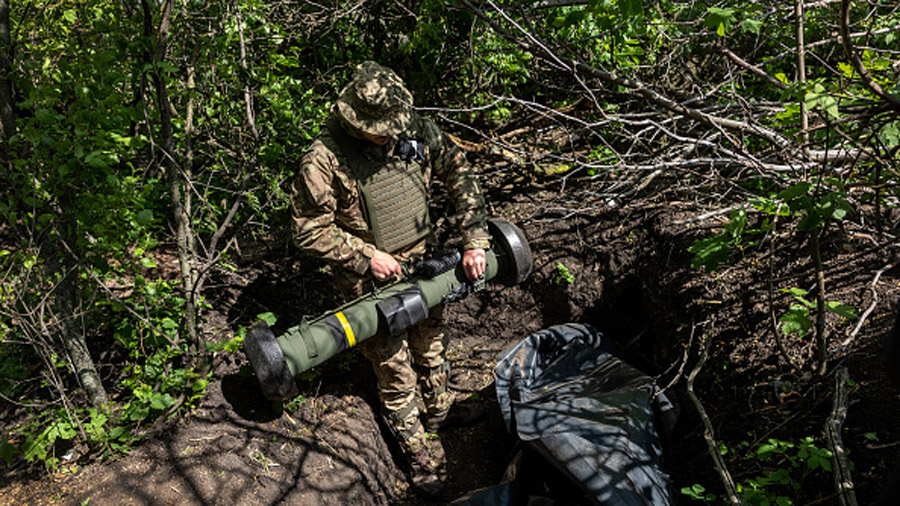 KHARKIV OBLAST, UKRAINE - MAY 20: A Ukrainian Army soldier places a U.S.-made Javelin missile in a ...