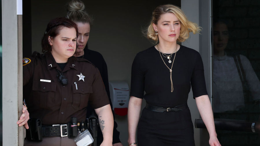 Actress Amber Heard (R) departs the Fairfax County Courthouse on June 1, 2022 in Fairfax, Virginia....