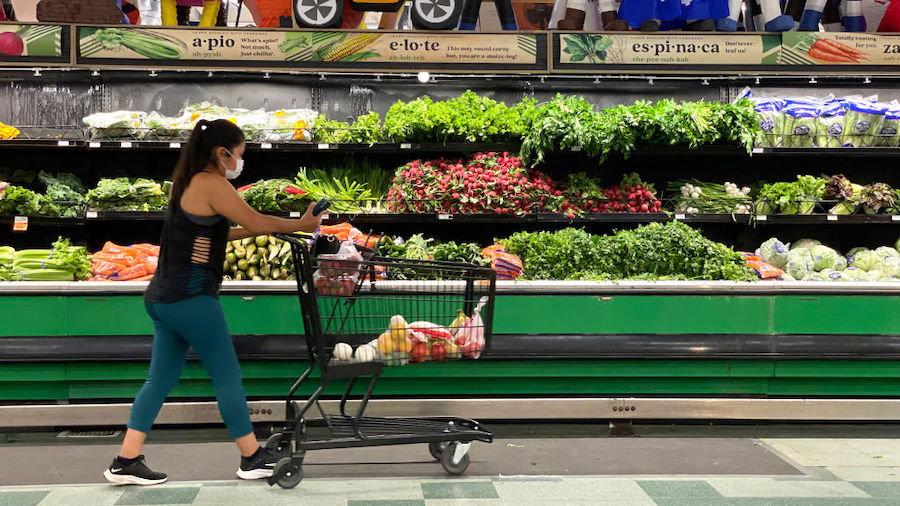 A customer shops for produce at a Cardenas Market on June 08, 2022 in San Rafael, California. The U...