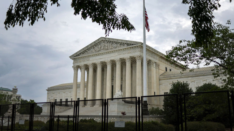 Fencing surrounds the U.S. Supreme Court as it nears the end of its term, June 27, 2022 in Washingt...