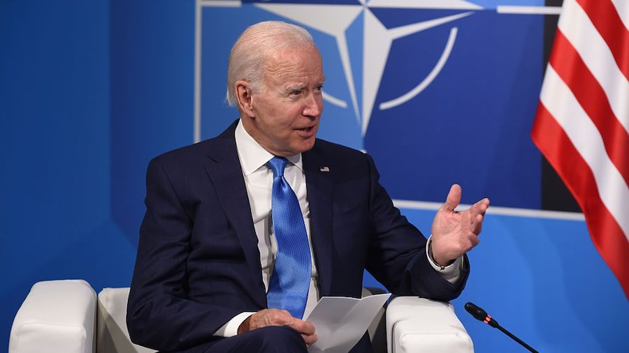 US President Joe Biden, speaks with Jens Stoltenberg (unseen) NATO Secretaty General at the NATO le...