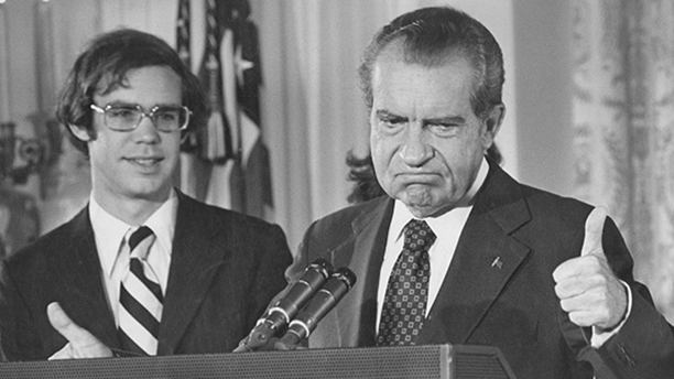 Richard Nixon (1913 - 1994) gives the thumbs up as he addresses the White House staff upon his resi...