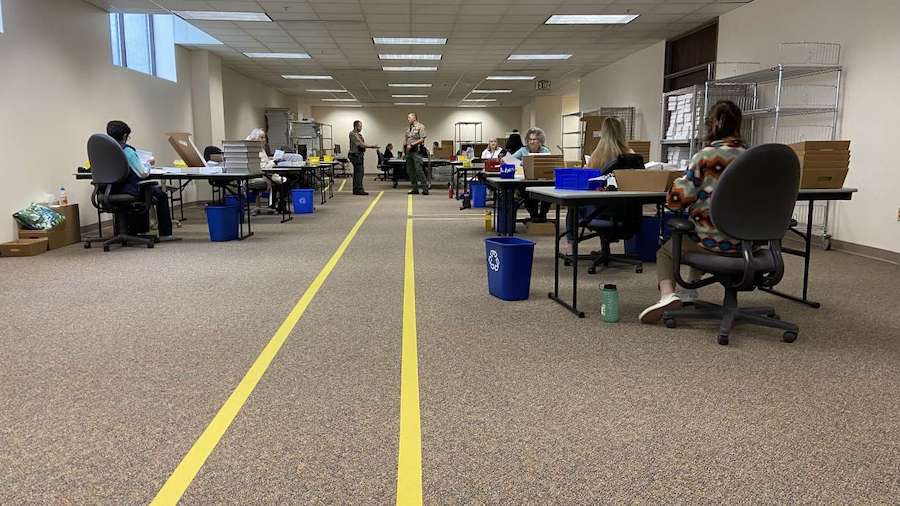 Yellow lines show where poll watchers can stand in the Salt Lake County Clerk's Office during the p...