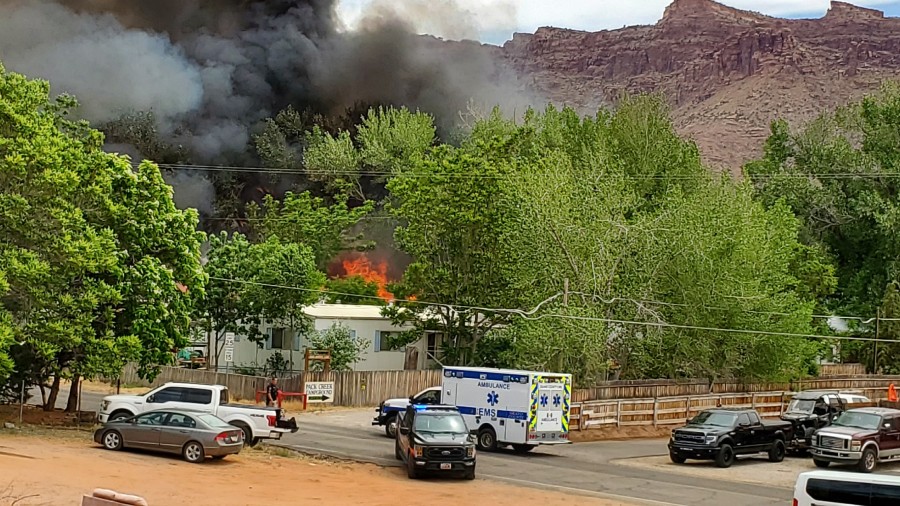 A mobile home on fire in Pack Creek, Moab. (Credit: Jim Collins.)...
