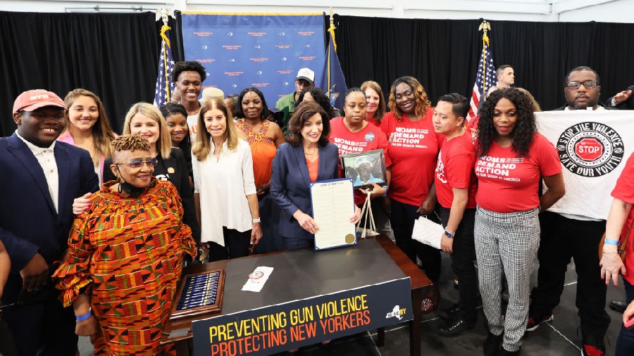 NEW YORK, NEW YORK - JUNE 06: Gov. Kathy Hochul takes a photo with the families of victims of gun v...