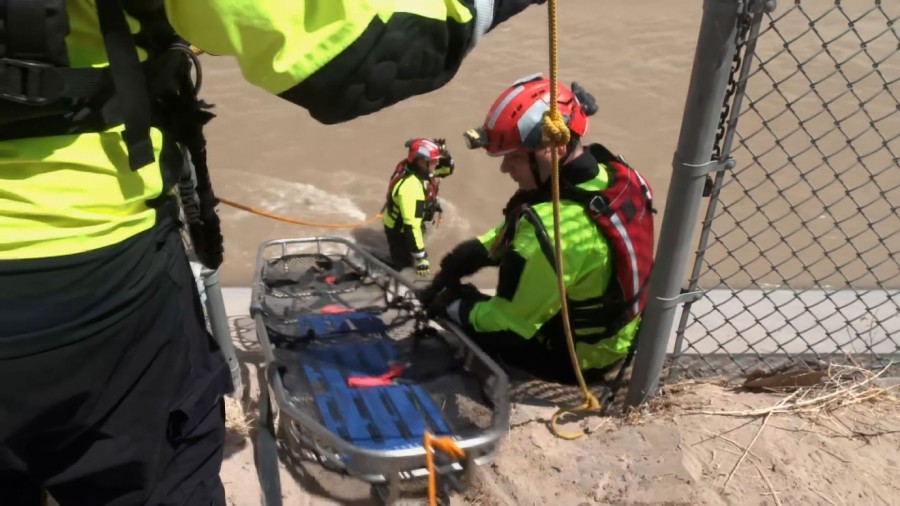 El Paso Fire Department water rescue team trains to take a body out of the canal in the event of a ...