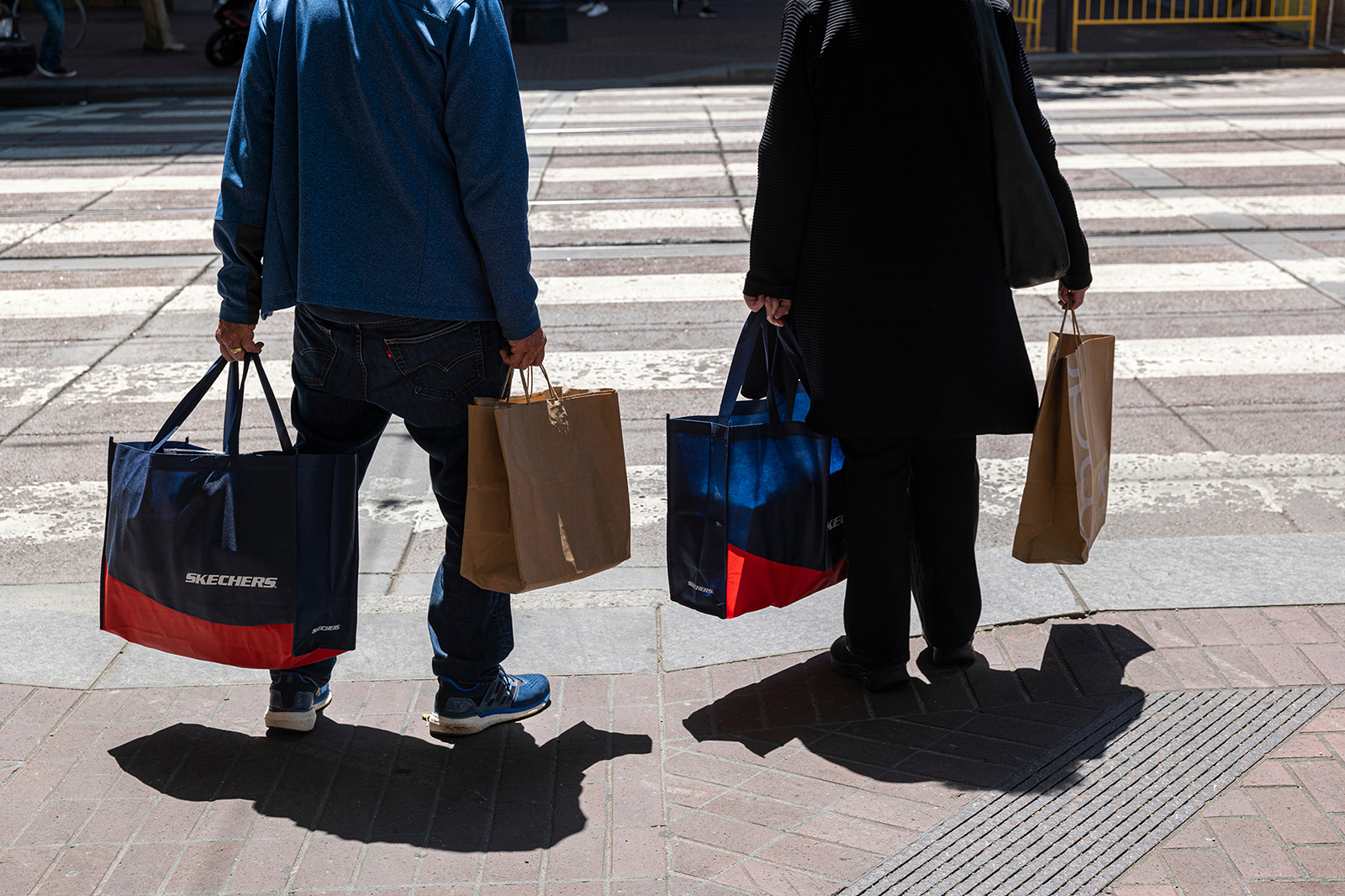 Pedestrians carry shopping bags in San Francisco, California, US, on Wednesday, June 1, 2022. US co...