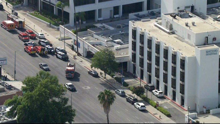 Emergency workers respond to the scene of a reported stabbing at the Encino Hospital Medical Center...