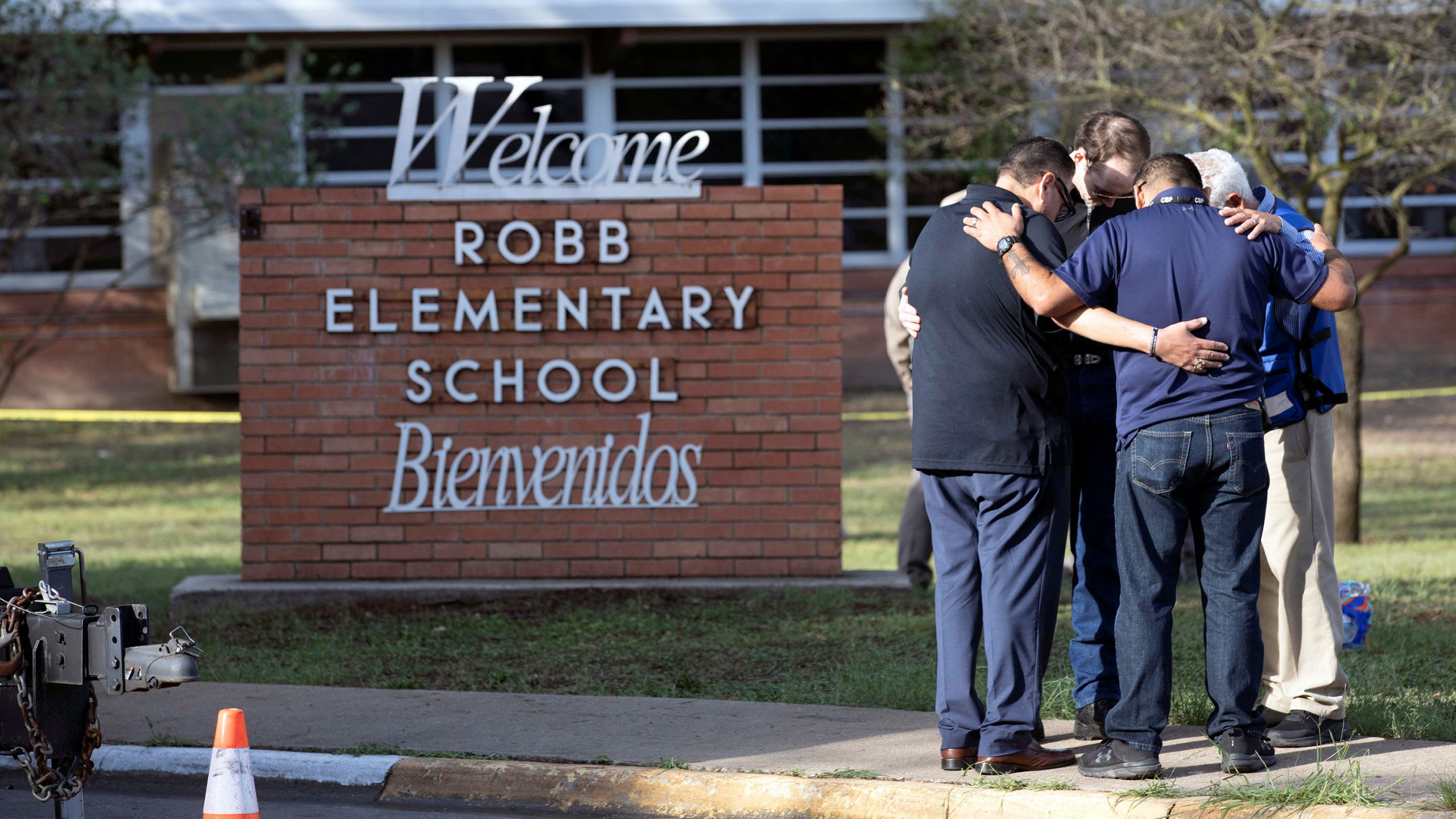 People gather at Robb Elementary School, the scene of a mass shooting in Uvalde, Texas, U.S. May 25...