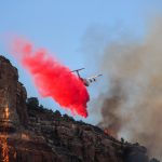 A plane deploying extinguisher on the Apple Valley Fire  (Chaice Moyes)