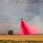 A plane deploying extinguisher on the Apple Valley Fire(Chaice Moyes)