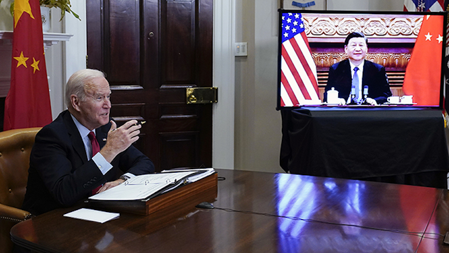 FILE - President Joe Biden meets virtually with Chinese President Xi Jinping from the Roosevelt Roo...