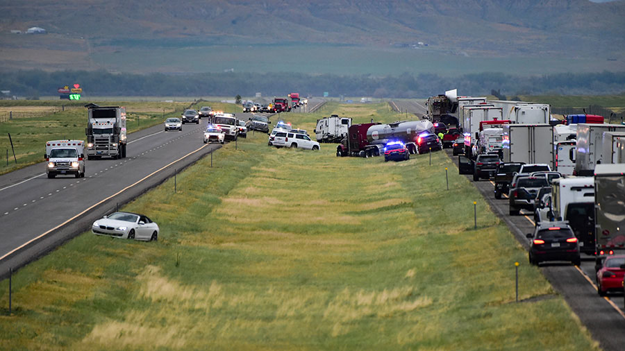 First responders work the scene on Interstate 90 after a fatal pileup Friday. (Amy Lynn Nelson/AP)...