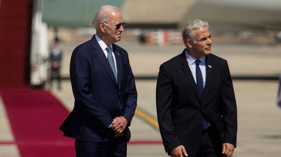 President Joe Biden and Israeli Prime Minister Yair Lapid during an arrival ceremony  at Ben Gurion...