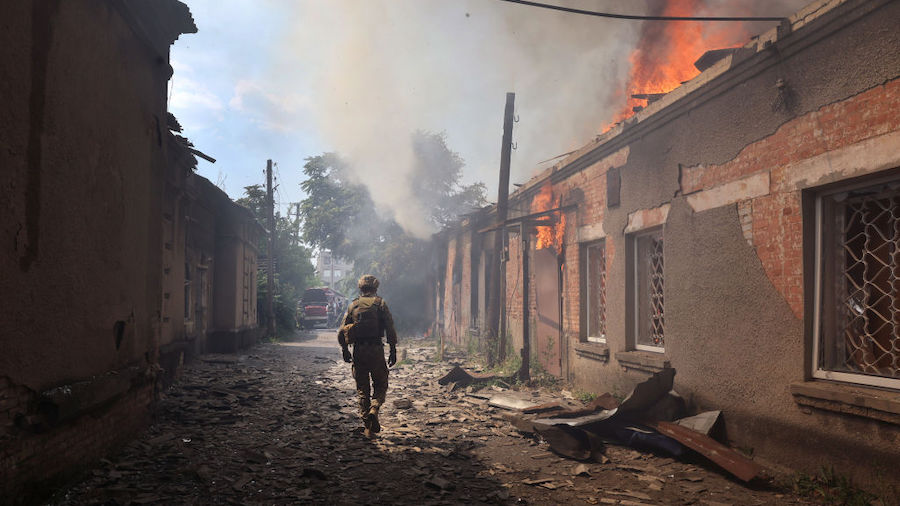 Fire burns at a shopping mall after it was struck by a missile on July 03, 2022 in Sloviansk, Ukrai...
