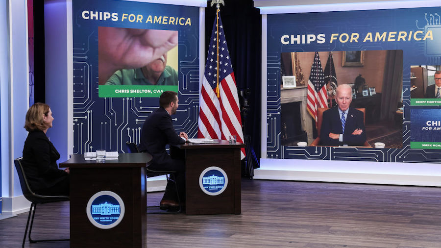 President Joe Biden listens as Communications Workers of America President Christopher Shelton spea...