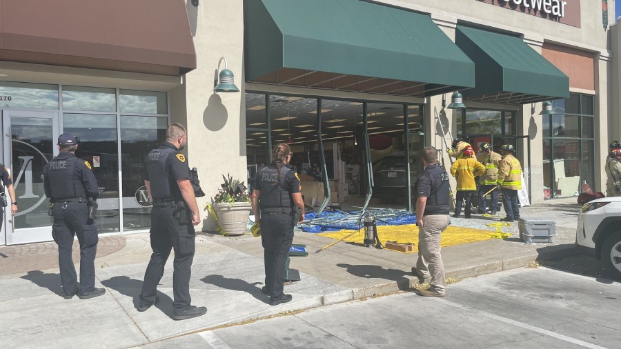 Fire crews and police at the car crash into the Famous Footwear. (Credit: SLC PD)...