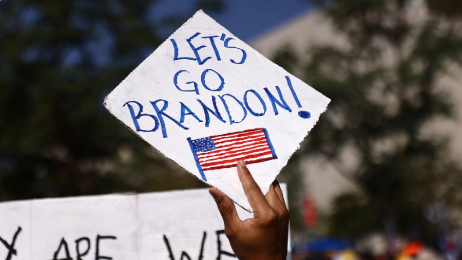 LOS ANGELES, CALIFORNIA - NOVEMBER 08: A protestor holds a 'Let's Go Brandon!' sign in Grand Park a...