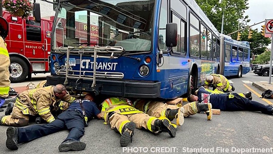 A 28-year-old woman who was struck by a bus and pinned underneath it is recovering after she was re...