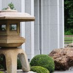 Attendees walk near the the Tokyo Japan Temple and a Japanese stone lantern on the grounds in Tokyo on Sunday, July 3, 2022.(Credit: The Church of Jesus Christ of Latter-day Saints)