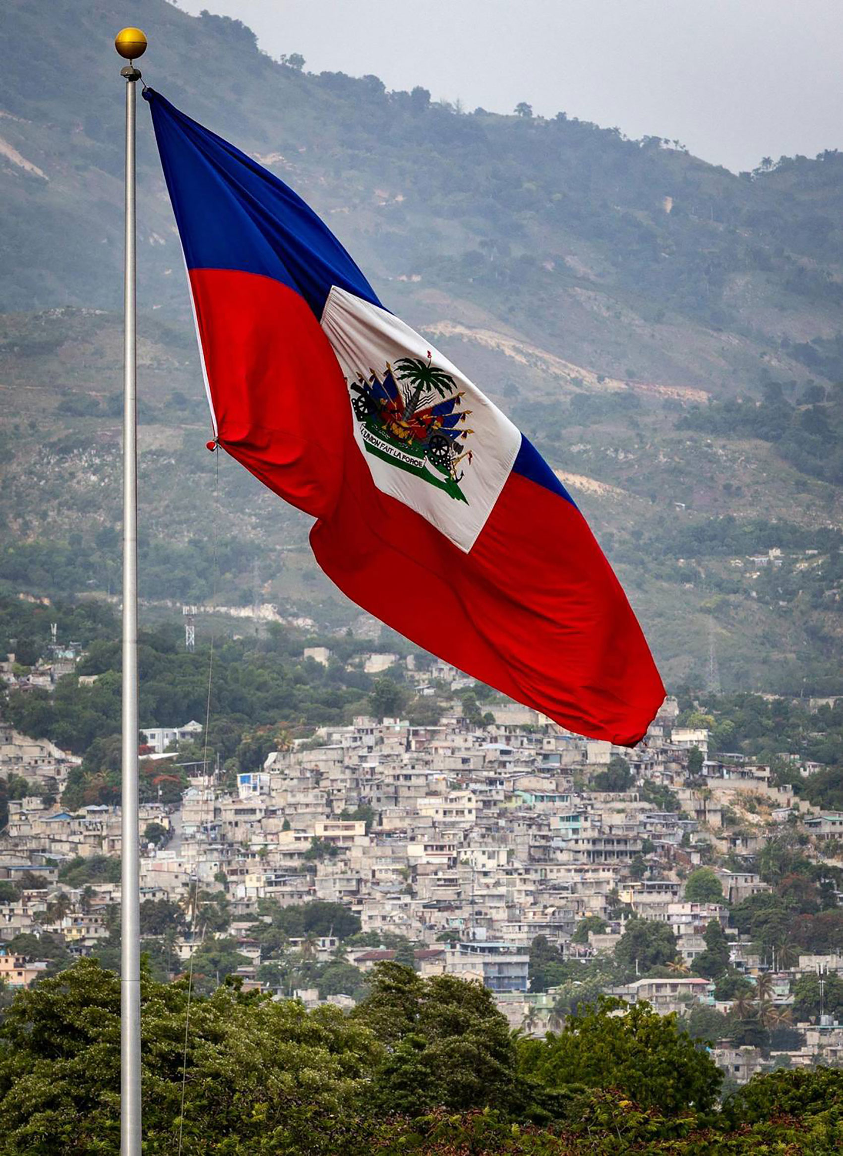 The Haitian flag waves over the Champ de Mars in Port-au-Prince, Haiti, on June 21, 2022. (Jose A. ...