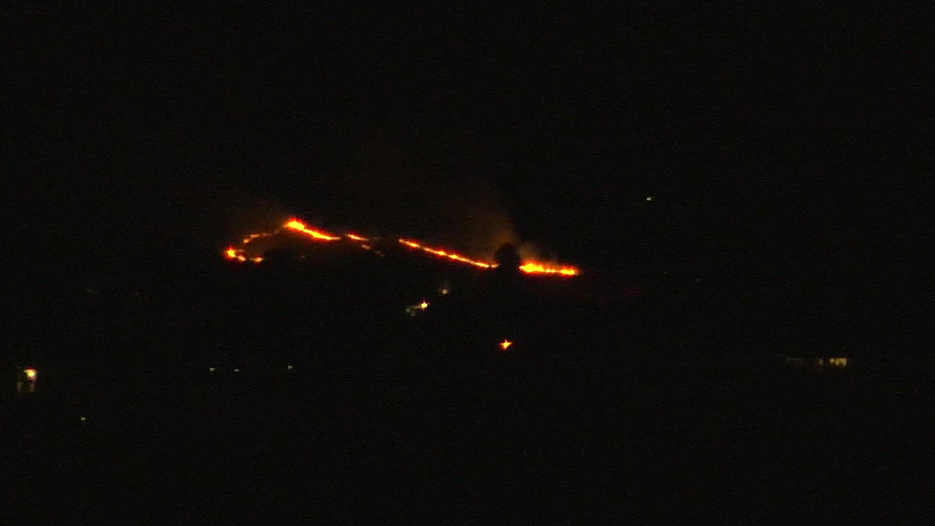 A grass fire burning near Ensign Peak early Friday morning, seen from the KSL TV roof camera. (KSL ...